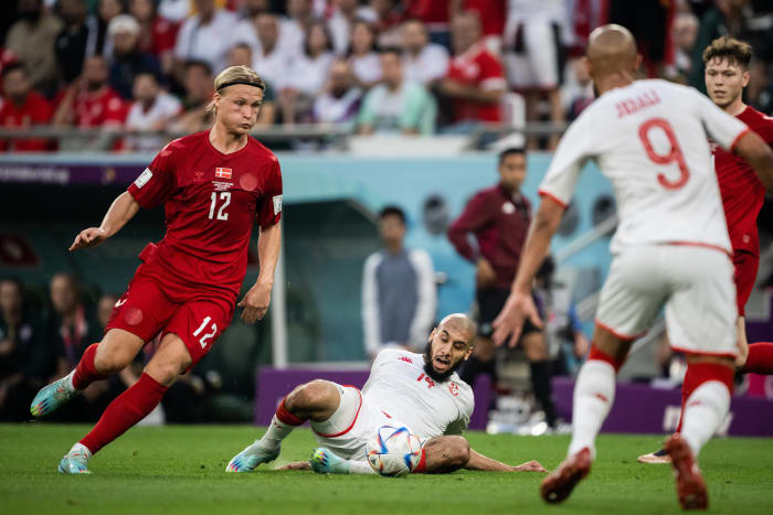 Tunisia defender Aissa Laidouni pictured (on the ground) during a game against Denmark at the 2022 FIFA World Cup